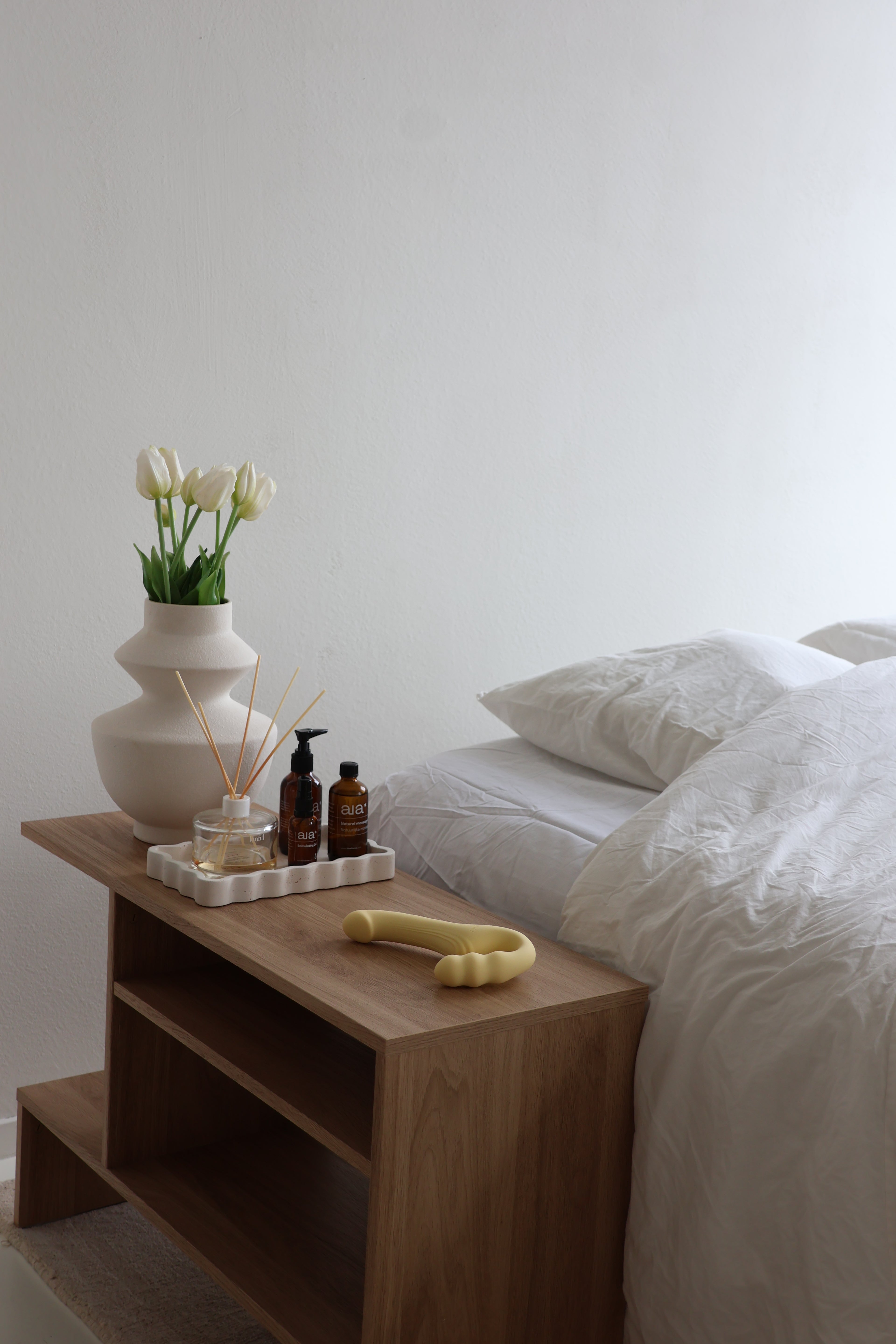 Strapless strapon vibrator on nightstand 